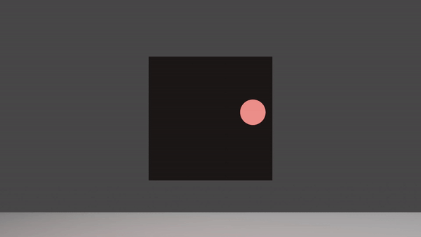 A black cube with a pink circle on its surface rotates