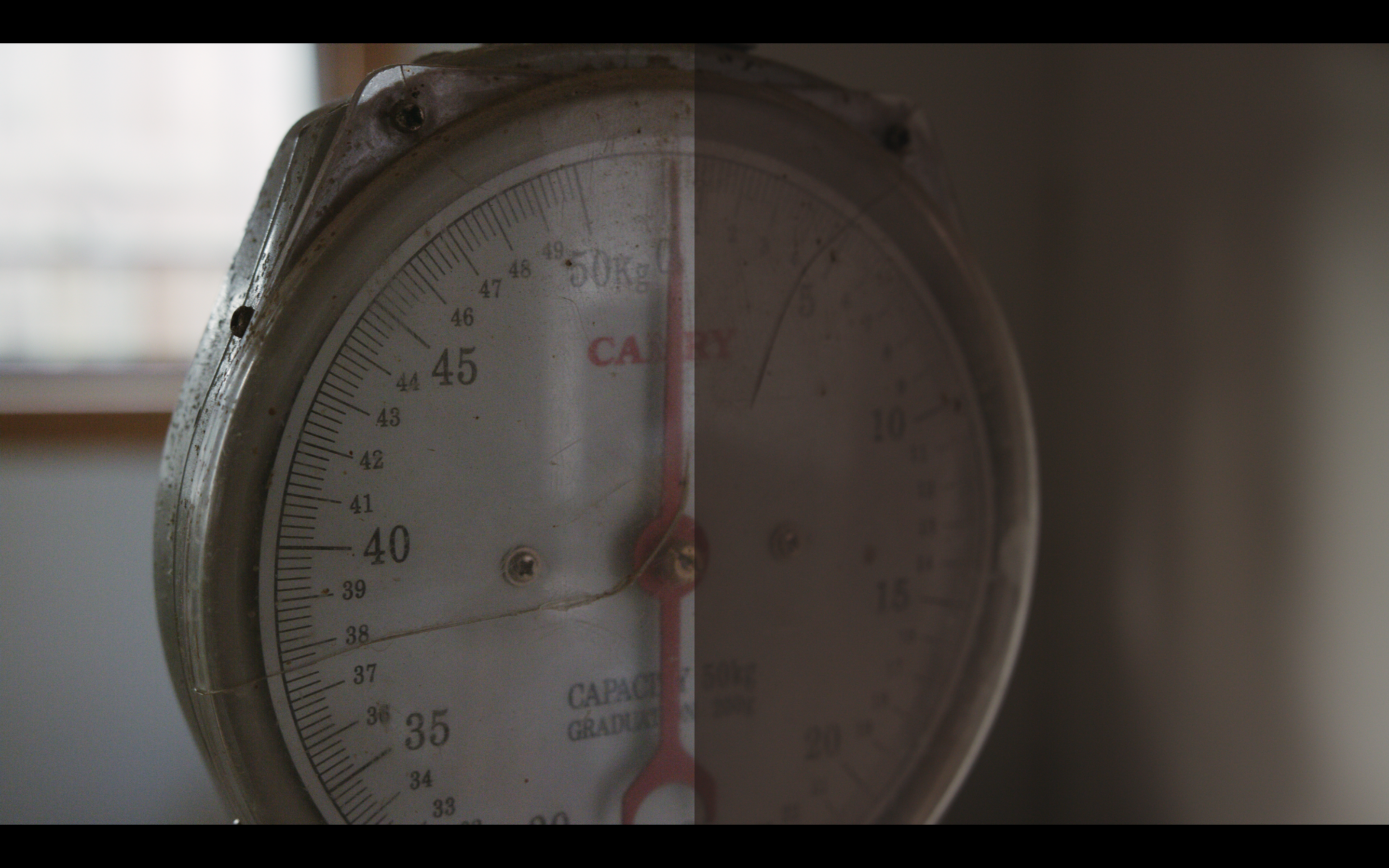 a color graded image of a clock to the left and a SLOG? version on the right