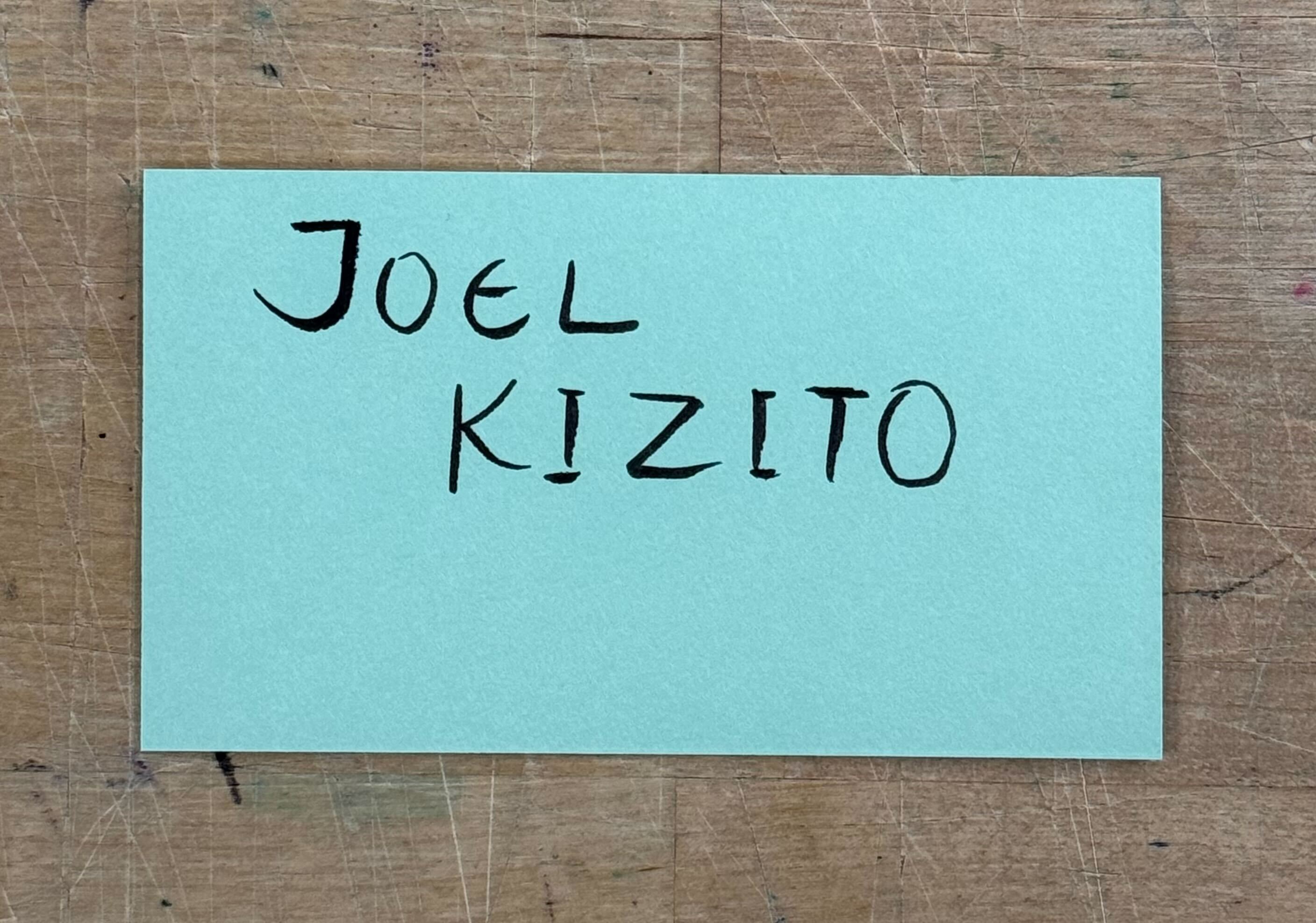 This is an image of Joel Kizito's tag